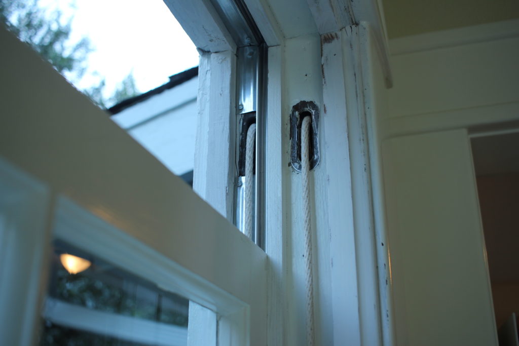 weather striping on upper sash of historic double hung window