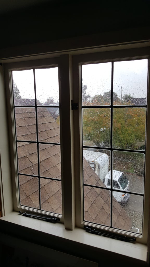 a closed out swing casement windows with zinc panels