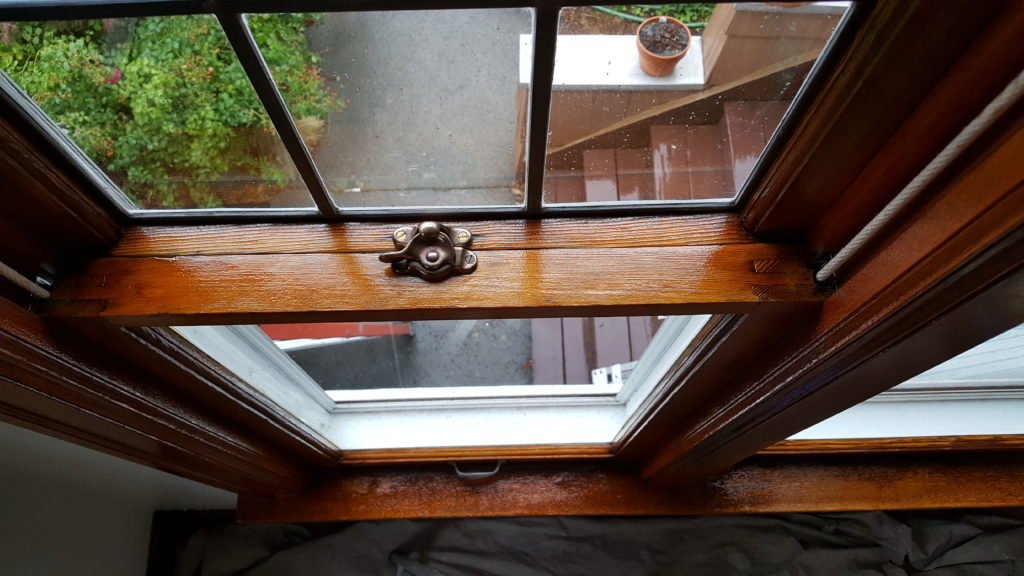 a restored single pane window finished with amber shellac