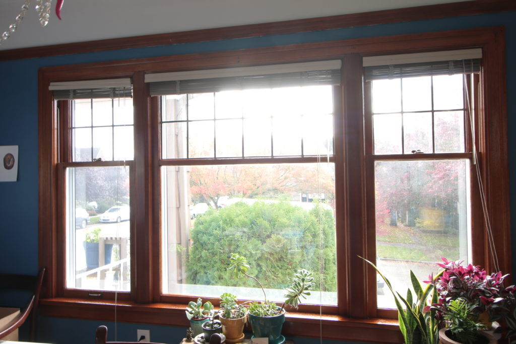 three restored windows with a amber shellac finish