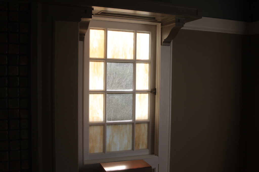 stained glass in wood casement window